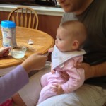 Rachel and Bryan feeding Sarah cereal